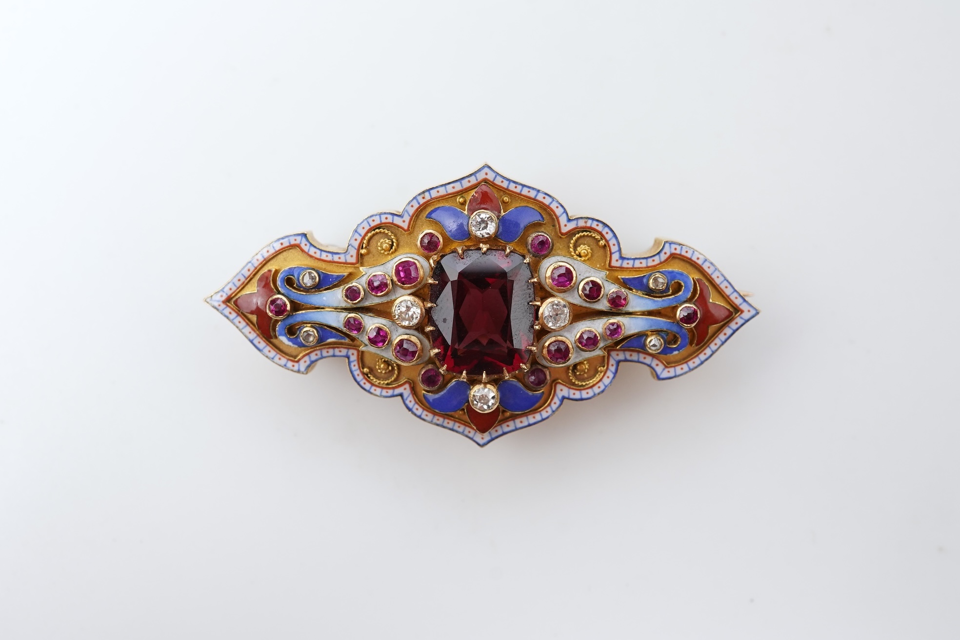 A fine Victorian Renaissance Revival tourmaline, diamond, ruby and enamel brooch, late 19th century